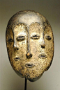 Africa | Mask from the Lega people of DR Congo | Wood, encrusted patina | ca. early 20th century