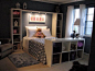 instead of a headboard...... bookshelves 'framing' the bed, and especially love the lights over head for reading ...