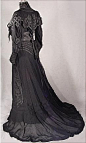 c. 1904 Black Etamine Fancy Trained Reception Gown appliqued in Taffetas. Back sideway