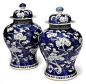 A PAIR OF CHINESE BLUE AND WHITE PRUNUS VASES AND COVERS  19TH CENTURY  Each painted with blossoming prunus branches issuing from the top and the base, Kangxi four-character mark to the base
#瓷#