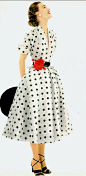 1952 Model in white and black polka-dotted dress of silk shantung by Donald Dress, Glamour