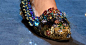 All the shoes at Dolce & Gabbana had a high-flying world traveler vibe, but none more so than these bejeweled flats. Standouts for both their genielike shape and heavy embellishment, they’d look pr...: 