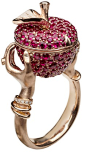 Stephen Webster poison apple ring in rose gold with rubies and diamonds. The apple opens to reveal a secret compartment