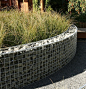 Gabions filled with graywacke pebbles