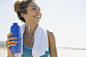 Active woman on the beach - stock photo