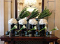 This weeks lobby flower display. White hydrangea, white calla lilies and green bells of Ireland mixed with birch