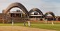 pavilion at rwanda cricket stadium mimics the movement of a bouncing ball :  