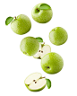 Falling Green juicy apple isolated on white background, clipping path, full depth of field stock photo
