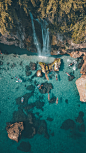 aerial photography of waterfalls and ocean