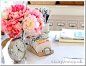 Love the flowers and the clock (and secretly the old school rolodex): 