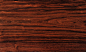 木材名称：南美小叶黑檀精选料（黑铁木豆）
产地：南美洲
规范名称：铁木豆
别名：南美黑檀、牛角木、南美牛角木
类别：深色名贵硬木
科属：蝶形花科铁木豆属
拉丁名：Swartzia sp.
颜色：深褐色
纹理：斜至略交错，常带有深褐色条纹
气味：无特殊气味
气干密度：1.1-1.2g/cm³
油脂含量：中
2014年市场原材料情况：口径约30cm-50cm
连天红家具平均出材率：6%-10%（树皮厚5-10cm，易裂，木性不稳定，出材率极低）
优点：
①纹理色泽与酸枝木相似，市场上俗称南美黑酸枝。
②木材重