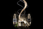 PETER SCHAFRICK  I  LIQUIDS AND SOLIDS  PHOTOGRAPHER  - COSMETICS - 7 : advanced anti-aging repairing oil, microalgae oil, cosmetic, treatment, on white, petrea dish, yin yang, two sides, balance, liquid, pour, elegant