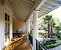 Two rocking chairs placed at the balcony on a bright day