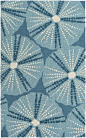 A color-filled accent to warm up any space, this Pescadero Teal Blue Area Rug decorated with large sea urchin-like shell images will be a wonderful addition to your coastal home.