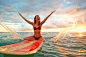 Pacific Islander woman playing on surfboard in ocean by Gable Denims on 500px