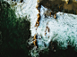 Drone view of the ocean washing on the cliffs at Corona Del Mar