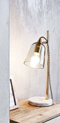 Desk lamp with a marble base.