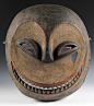 Ibibeo People, Southern Nigeria, Eket Mask, in carved and painted wood, circa 1960. 18" x 16"