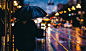 Person with umbrella walking through rainy street, California St & Hyde St, Nob Hill, San Francisco