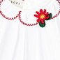 Baby Girls Ivory Cotton Blouse with Embroidery : Baby girl's gorgeous long-sleeved blouse by Gucci, made with a soft and lightweight ivory cotton blend. It has a round, scalloped collar with red, embroidered trim and flower appliqué. The split back fasten