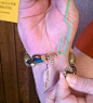 Use a paper clip to put bracelets on. Genius--I tell you--genius!!!