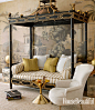 In a guest room, a Ceylon et Cie chinoiserie daybed — inspired by Thomas Chippendale's designs — and de Gournay's Early Views of India wallpaper are a "theatrical nod to the Raj." Josephine chair, Restoration Hardware. Hans Barbell brass table b