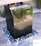 Contemporary Outdoor Fountain Design with Stone Accessories