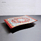 来自工作室Duffy London的一个有趣创意，飞毯茶几（Flying Carpet Coffee Table），茶几的表面是像素化的波斯地毯图案，而底座的造型和表面几乎一模一样，只是颜色更深，看上去就像是表面投下的影子一般——于是，整个茶几就变成了一张自由漂浮的飞毯~