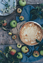 baked pie beside green apples