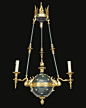 A Fine Gilt and Patinated Bronze Empire Style Globe Three-Light Chandelier  French, Circa 1880.