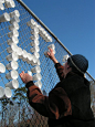 With cups and a fence, you can create a billboard to announce your movie night event at school