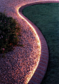 Rope lighting around the garden...inexpensive, waterproof-good to know, considering doing this around edge of new patio.