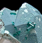 mineralists:

Plancheite over Quartz with tiny crystals of Dioptase