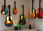 Old guitars turned stained glass lamps