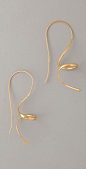 gold curly earrings: 