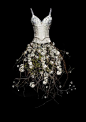 It looks like digital art - a collage of a corset, branches, and flowers: 