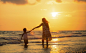 Photograph Mother with her daughter on the beach by Sasin Tipchai on 500px