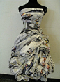 Newspaper Dress with lovely texture detail // fashion meets art. This dress is poportioned perfectly to the pont where it looks like something cute to wear out. I enjoy how the person only used news paper to make it look so form fitting. It looks elegant