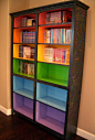 Colored Bookshelves. I love this. Just cheap pine book cases,dark wood stain and rainbow paints : )