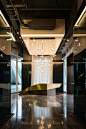 COSMO - Atelier I-N-D-J : A four story real estate showroom in Chengdu, China, designed by Ian Douglas-Jones of Atelier I-N-D-J. The design takes customers on a carefully curated journey via stairs and elevators as customers are introduced to a mixed use 