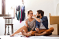 Young couple sitting on the floor moving in new house. by Jozef Polc on 500px