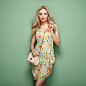 Blonde young woman in floral summer dress