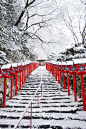 snowy stairs with red lanterns in Kyoto, Japan