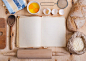 Baking background with blank cook book, eggshell, flour, rolling by Elena Yeryomenko on 500px