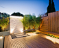 Inspiration for a contemporary backyard water fountain deck remodel in Sydney