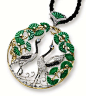 Jade Culture's Creation : JADEITE, DIAMOND AND BLUE SAPPHIRE 'CRANE AND PINE' PENDANT.  The circular openwork pendant centring on two cranes set with brilliant-cut diamonds and black diamonds, accented by blue sapphire-set eyes, to a surround of pine tree