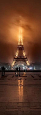 Foggy night at the Eiffel Tower in Paris 