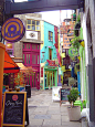 London, off the beaten path...Neal's Yard, Covent Garden, London. Neal's Yard is a small alley in Covent Garden between Shorts Gardens and Monmouth Street which opens into a courtyard. It is named after the 17th century developer, Thomas Neale. It now con