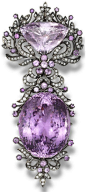 A kunzite and diamond brooch.  Designed as a detachable brooch, which can be worn as two separate pendants, set with an oval mixed-cut and a triangular mixed-cut kunzite, within a foliate surround set with circular-cut kunzites and brilliant-cut diamonds,