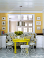 Bright yellow walls — Benjamin Moore's Inner Glow — and an even brighter citron table from HB Home brought the white-and-gray kitchen in a Charlotte, North Carolina, house to life. Designer Lindsey Coral Harper turned wire side tables from ABC Carpet &